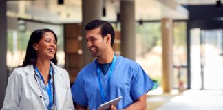 Two people smiling Description automatically generated with low confidence
